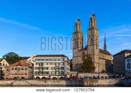 Beautiful view of Zurich old town with Grossmunster Church and Limmat river at dusk Zurich Switzerland.