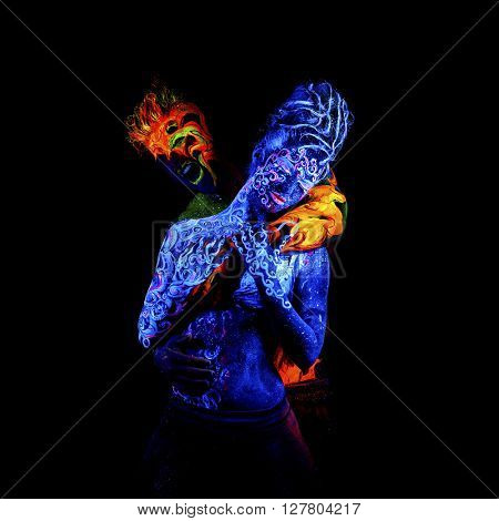 Fire and Air. Body art glowing in ultraviolet light, four elements, isolated on black background