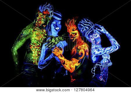 Four elements. Body art glowing in ultraviolet light, isolated on black background