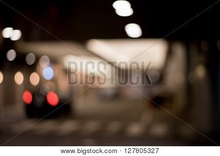Blurred / Defocussed abstract background of hotel entrance with lights and Taxi Taillight taken in Japan