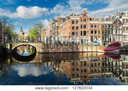 Houses over canal with mirror reflections, Amstardam, Netherlands