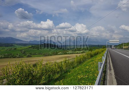 Highway In Slovakia. Meadows And High Tatras Peaks Panorama On Background. Presov Region, Slovakia.