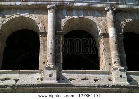 In this picture a close detail of the archs of the majestic Colosseum in Rome