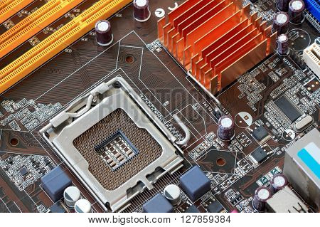 Focus CPU socket on motherboard of computer for the design background technology.