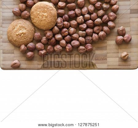 Homemade delicious cookies biscotti with hazelnuts on the table. horizontal top view from above. Bamboo and wooden board background with free text space