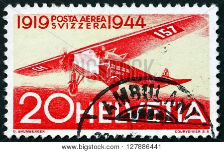 SWITZERLAND - CIRCA 1944: a stamp printed in the Switzerland shows Fokker Airplane 25th Anniversary of the 1st Regular Air Route in Switzerland circa 1944
