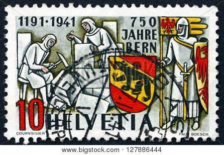 SWITZERLAND - CIRCA 1941: a stamp printed in the Switzerland shows Masons Knight and Bern Coat of Arms 750th Anniversary of Bern circa 1941