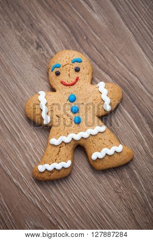 Gingerbread Man Cookie On Wooden Table