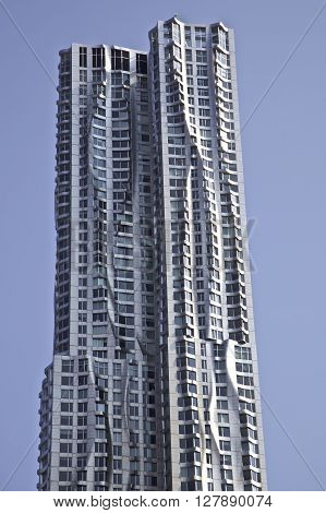 Beekman Tower 76-story skyscraper designed by architect Frank Gehry in the New York City borough of Manhattan. 8 Spruce Street NYC USA NEW YORK CITY - AUGUST 18 2015: Spruce Street skyscraper know as the Beekman Tower or or New York by Gehry. The modern r