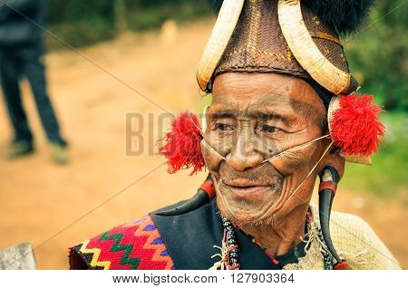 Old Man With Plugs In Ears