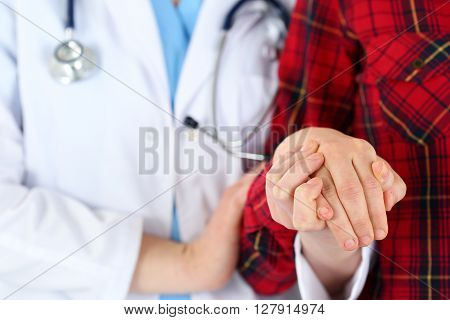 Woman doctor hands holding female child patient hand. Partnership, medical ethics, patient cheering, news lessening, physician make round, physical, examination, 911, healthy lifestyle concept
