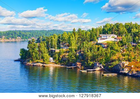 Scenic summer Scandinavian Swedish countryside landscape - sea islands forests and villages with cottages