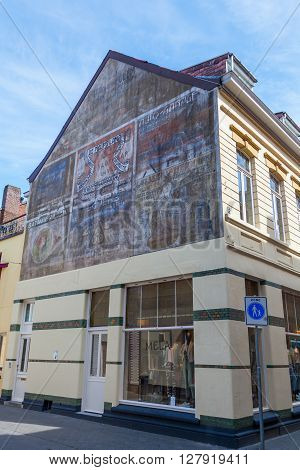 Valkenburg Netherlands - April 11 2016: historical advertisement at a house wall in Valkenburg. Valkenburg aan de Geul in the province Limburg is a popular tourist destination