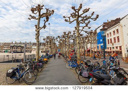 Maastricht Netherlands - April 11 2016: Vrijthof in Maastricht with unidentified people. Vrijthof the largest and best-known square in Maastricht with many well-known pubs and restaurants