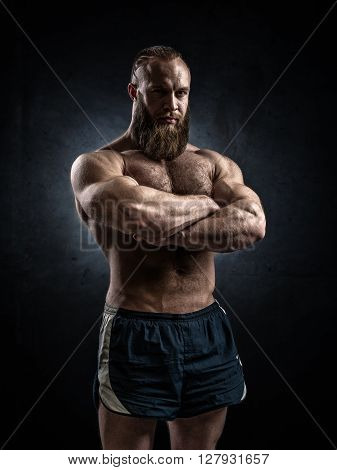 Bodybuilder Topless Over Grunge Background.