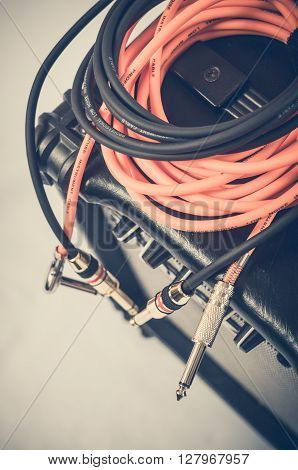 Close-up of guitar amplifier with jack cable.