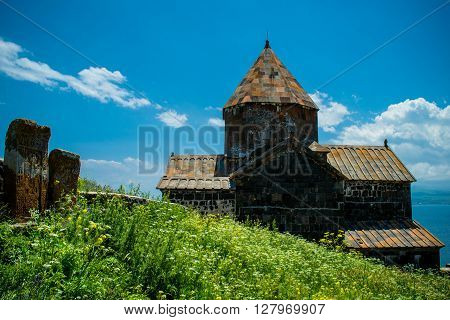 Photo of the Landscape with church Khachkars and grass