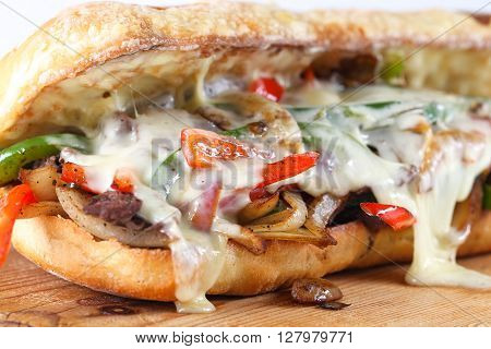 Tasty Beef Steak Sandwich With Onions, Mushroom And Melted Provolone Cheese In A Ciabatta