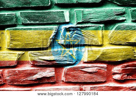 Brick wall Ethiopia flag with some cracks and vintage look