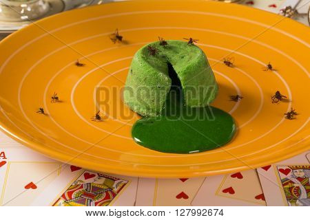 Petit gateau with green sava ant. Gourmet dessert.