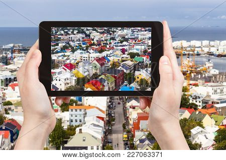 Travel Concept - Tourist Photographs Residential Houses In Reykjavik City In Iceland In September On