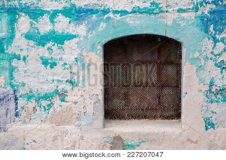 Old Building In Montenegro With Windows And Shutters And Ivy