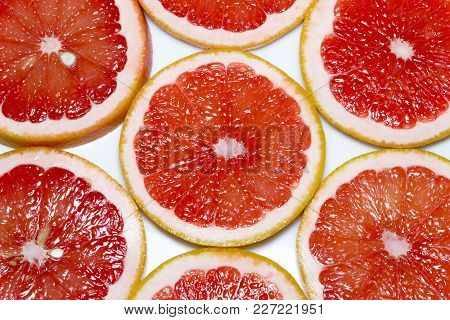 Grapefruit Slices Isolated On The White Background.