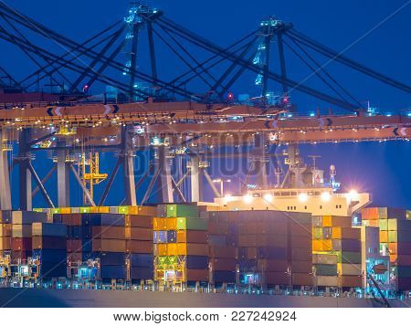 Detail Of Container Ship Unloading At Automated Harbor Terminal In Maasvlakte Europoort Port Of Rott