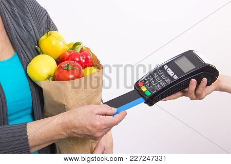 Hand Of Senior Woman Using Payment Terminal With Credit Card, Cashless Paying For Shopping, Fruits A