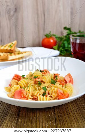 Warm Salad With Seafood In A White Bowl On A Wooden Background. Pasta Radiatori With Crayfish, Shrim