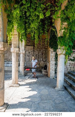 Balchik, Bulgaria, June 25, 2017: a man playing xylophone in Balchik Palace gardens in Balchik, Bulgaria