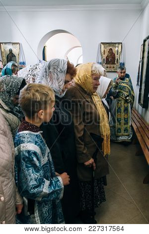 Voyutyn, Volyn / Ukraine - October 14 2017: Orthodox Priest And Ukrainian Parishioners Of Church Dur