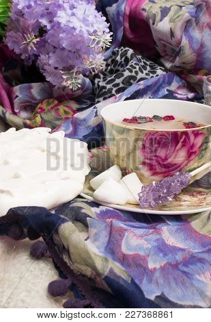 Cup Of Berry Tea With Delicious White Merengue On The Violet Shawl. Sweet Morning With Tea.