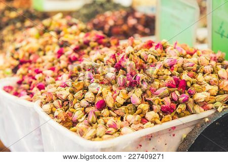 Close Up View Of Tea Rose Buds On A Food Market In Tel Aviv, Israel. Selective Focus, Space For Text