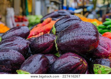 Eggplants Displayed For Sale In The Market, On A Rainy Day
