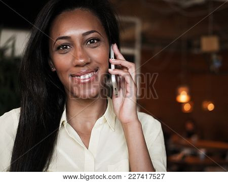 African American woman talking on a mobile phone - Black people