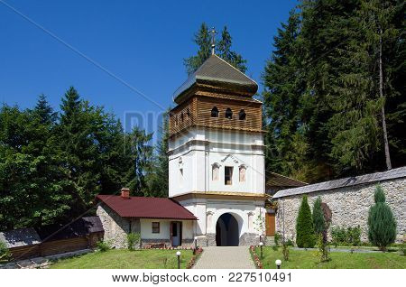 Old Monastery On Sunny Day Against The Blue Sky In Maniava, Ivano-frankivsk Region In Ukraine. Horiz