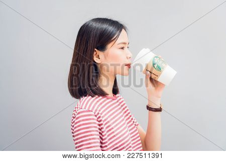 Bangkok, Thailand - February 20, 2018 : Woman Drinking Starbucks Coffee On The Chair, Starbucks Bran