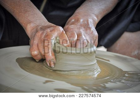 A Woman In A Small Village In Vietnam Make Pottery At Home