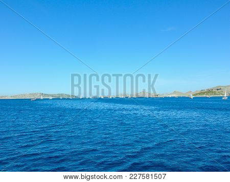 Sea Surface Aerial View. Background Shot Of Clear Sea Water Surface. Blue Sea Water In Calm. Sea Tex