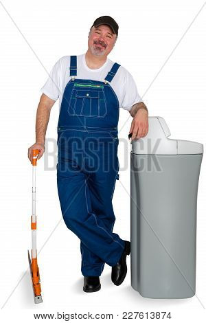 Warehouse Worker Gesturing With His Hand At A Large Box With A Quizzical Expression Asking If This I