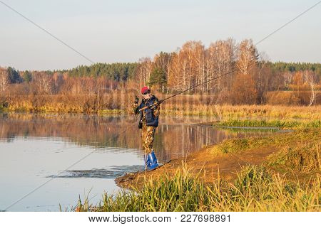Woman Catches A Fish On Spinning