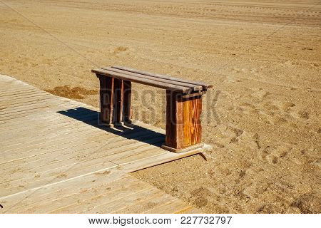 Wooden Bench On The Beach, Close View