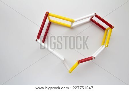 Plastic Heart Toy On White, Red, Yellow,white Plastic With Soft Light