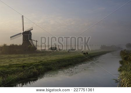 Wingerdse Mill Near The Dutch Village Bleskensgraaf In Misty Morning Atmosphere