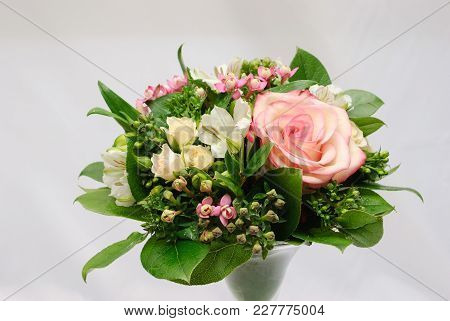 Greeting Bouquet Of Rose Bush, Alstroemeria, Bouvardia And Salal In Glass Vase On White Background