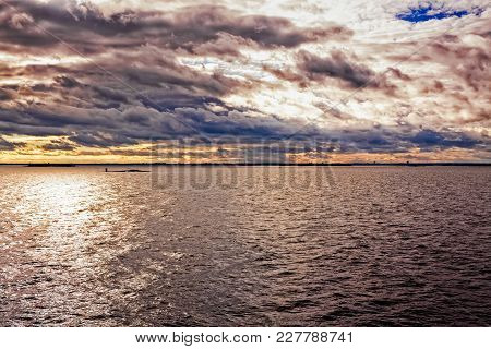 The Sun Is Setting Over The Baltic Sea. You Can See The Skyline Of Tallinn, The Capital Of Estonia, 