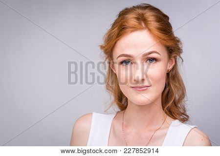 Closeup Portrait Young, Beautiful Business Woman, Student With Lred, Curly Hair And Freckles On Face
