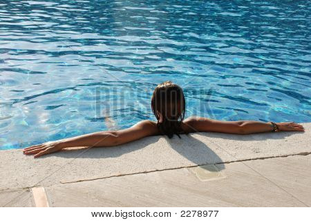 Woman Relaxing In Pool