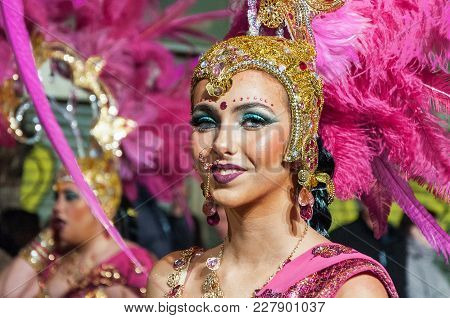 Portrait Of Young Girl At Parade Costumed Characters, Through The Streets Of The City. February 11, 